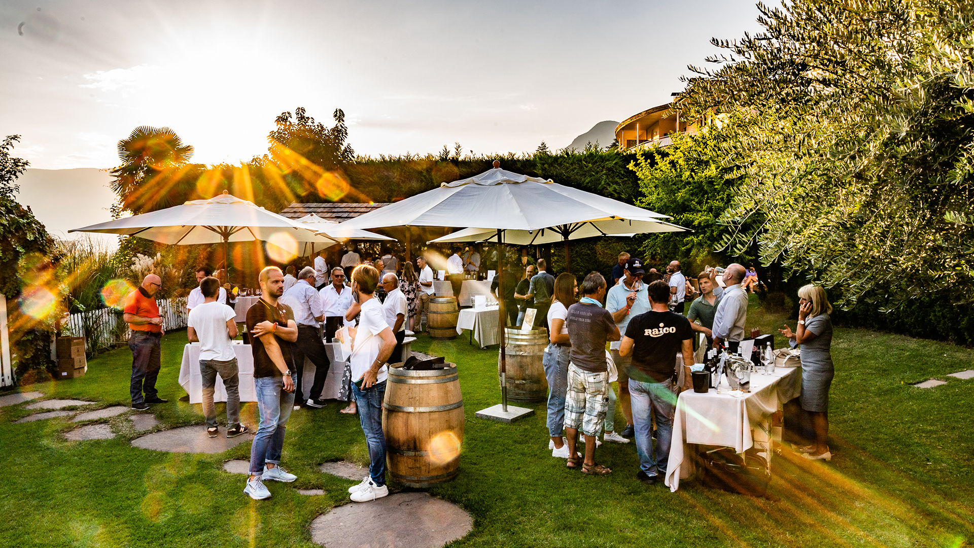 An open-air wine-tasting event where many visitors are intent on tasting wines from various South Tyrolean wineries.