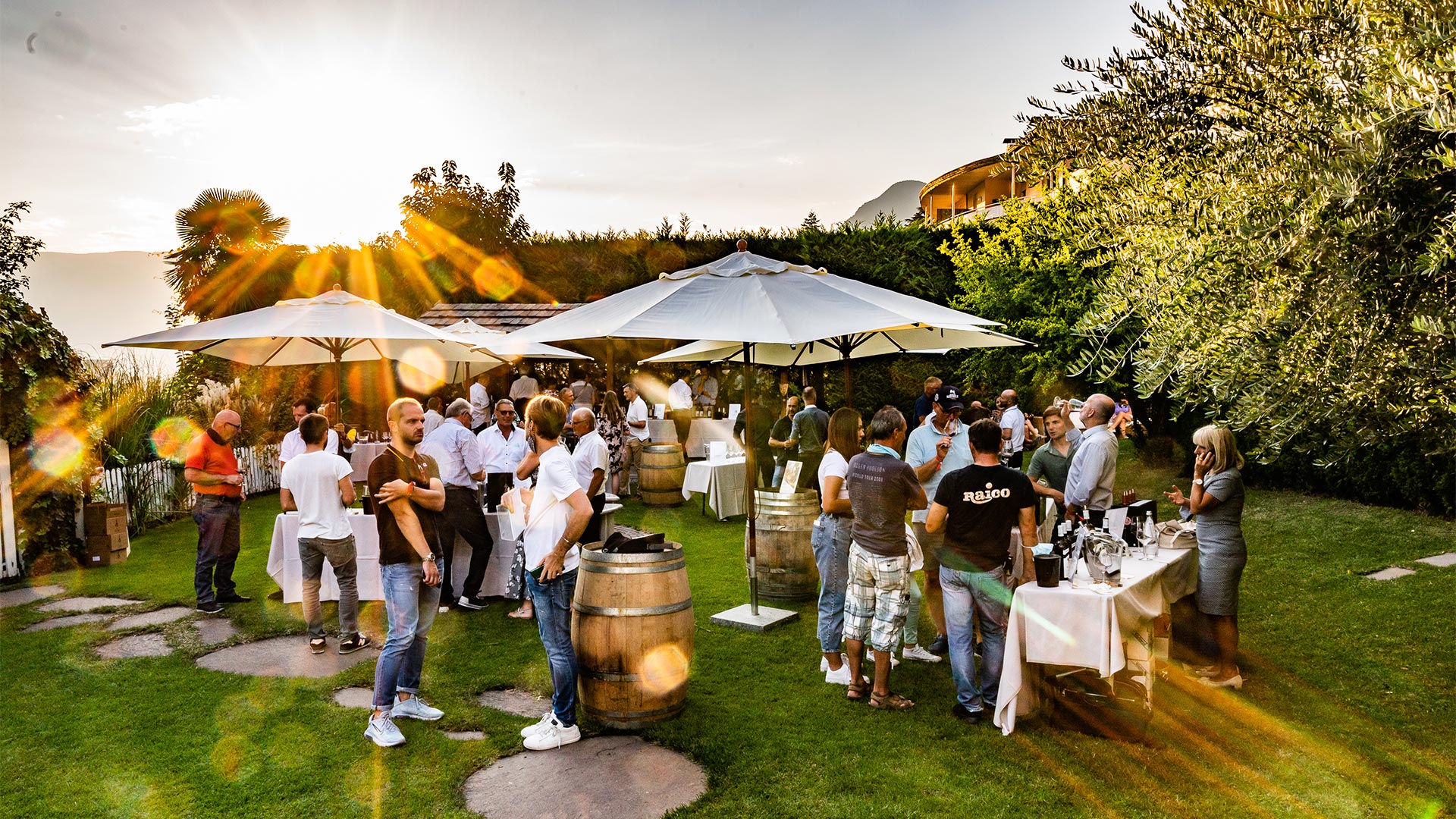 An open-air wine-tasting event in which many visitors are intent on tasting wines from various South Tyrolean wine cellars. 